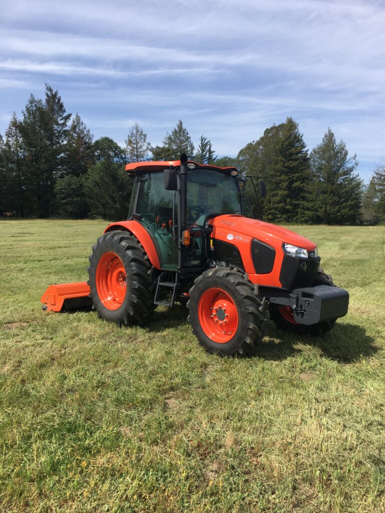 Kubota M 111 owned by Barlow Enterprises LLC serving Sonoma County, California, high weed mowing